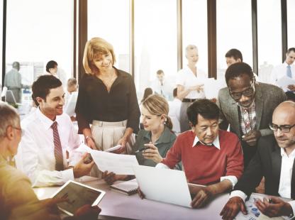 photo of a group of professionals collaborating at a table